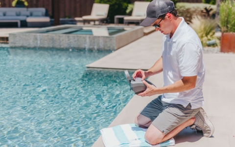 Swimming pool maintenance staff member.