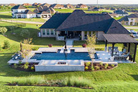 Wide angle image of a house with an outdoor swimming pool.