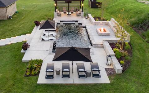 Residential outdoor swimming pool with fire pit
