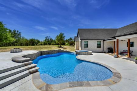 Freeform pool in garden.