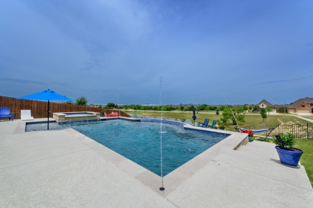 Pool with water sprinklers.