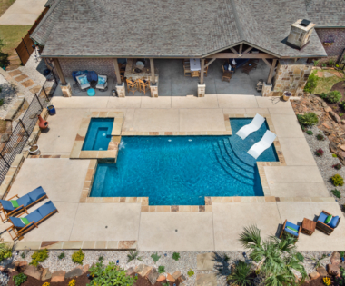 birds eye view of Pool chairs in pool.
