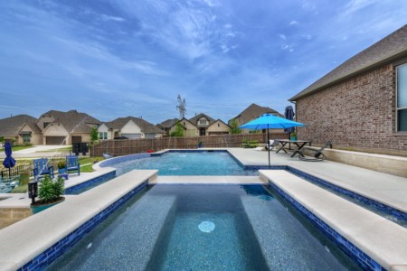 Pool with water sprinklers.