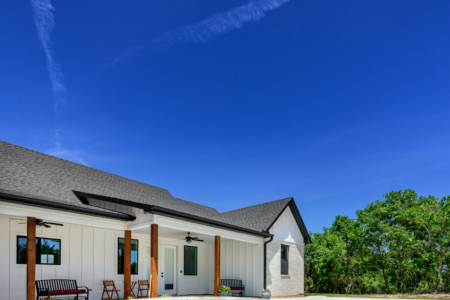 Pool with jacuzzi in back garden.