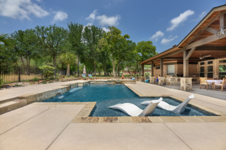 Pool chairs in pool.
