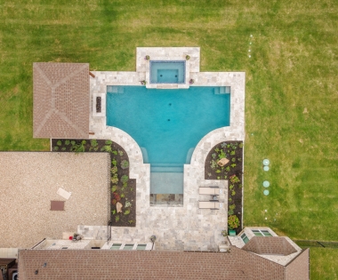 Drone shot of jacuzzi with pool.