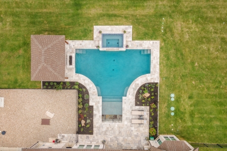Drone shot of jacuzzi with pool.