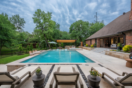 Rectangular pool with outdoor seating.