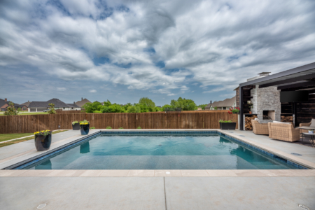 Rectangular pool on cloudy day.