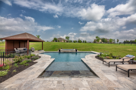 Unique pool with seating area.