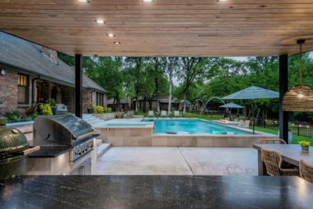 Outdoor barbecue and seating area.