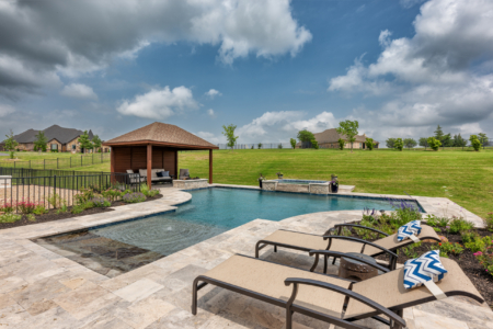 Unique pool with seating area.