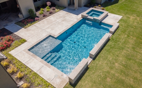 swimming pool with paving deck.