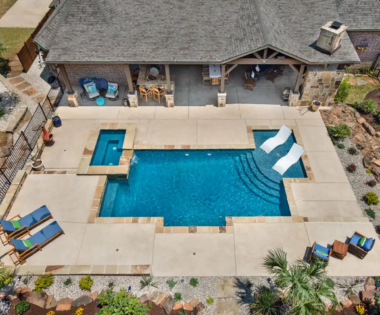 birds eye view of Pool chairs in pool.