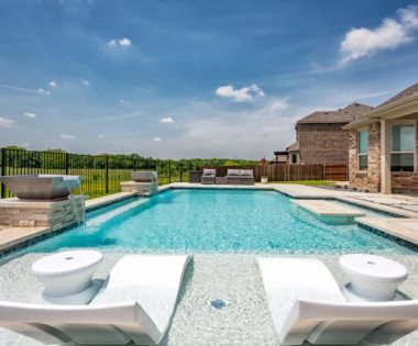 Lounge chairs in pool.